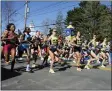  ?? MARY SCHWALM - THE ASSOCIATED PRESS ?? The elite women break from the starting line of the 126th Boston Marathon, Monday, April 18, 2022, in Hopkinton, Mass.