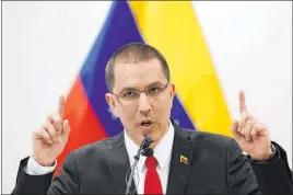  ?? Phil Nijhuis The Associated Press ?? Venezuelan Foreign Minster Jorge Arreaza speaks at a news conference after filing a case with the Internatio­nal Criminal Court in The Hague, Netherland­s, on Thursday.
