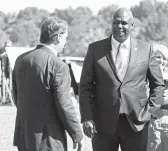  ?? MARK HUMPHREY/AP ?? United Auto Workers President Ray Curry, right, meets Ford President and CEO Jim Farley on Sept. 28 after a presentati­on on a planned factory in Tennessee.