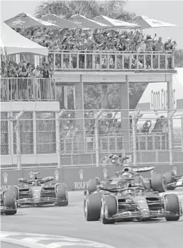  ?? JOHN MCCALL/SOUTH FLORIDA SUN SENTINEL ?? Fans watch the Miami Grand Prix on Sunday at the Miami Internatio­nal Autodrome in Miami Gardens.