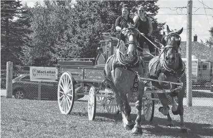  ?? DESIREE ANSTEY/JOURNAL PIONEER ?? Jacqueline Phelan, from left, and Katelyn Ostridge compete in the team category for horses.