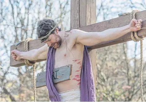  ?? Picture: Grant Bulloch ?? Calum Barbour playing Jesus in the outdoor Easter Play staged in Edinburgh’s Princes Street Gardens