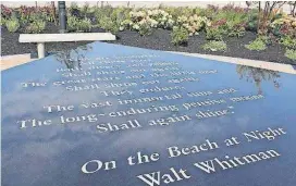  ?? [AP PHOTO] ?? A table containing the Walt Whitman poem “On the Beach at Night” is shown Thursday. The table is part of a new memorial being dedicated today on the 16th anniversar­y of the Sept. 11 terror attacks.