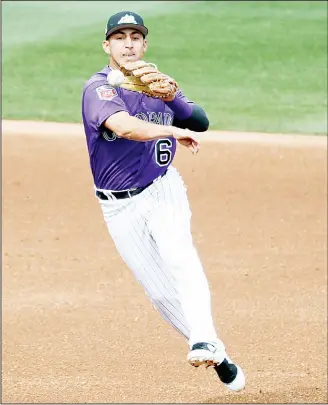  ??  ?? Colorado Rockies shortstop Daniel Castro throws out Seattle Mariners’ Dee Gordon at first during the fifth inning
of a spring training baseball game in Scottsdale, Arizona on March 13. (AP)