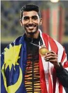  ??  ?? Nauraj posing with his gold medal during the SEA Games at the National Stadium in Bukit Jalil on Aug 26, 2017.