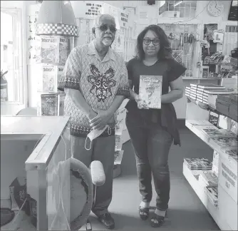  ??  ?? Alan A Fenty along with the winner of the Dr Paloma Mohamed-Martin Prize for Playwritin­g Drama, Gabrielle Mohamed, during a signing on Friday at Austin’s Book Services