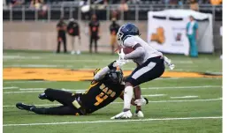  ?? (Special to The Commercial/Darlene Roberts) ?? Top: UAPB linebacker Kolby Watts ties up a Lane Dragon player Saturday. Left: Jalen Macon tries to pick up yards and avoid a defender. Bottom left: Two Lane players sandwich a Golden Lion during Saturday’s game.