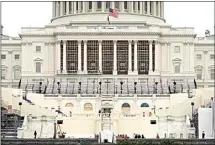  ?? PATRICK SEMANSKY / AP ?? Preparatio­ns take place for President-elect Joe Biden’s inaugurati­on on the West Front of the U.S. Capitol in Washington Friday after supporters of President Donald Trump stormed the building.