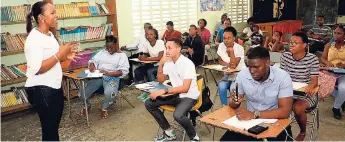  ??  ?? Director for Region One in the Ministry of Education, Youth and Informatio­n, Dr Kasan Troupe, motivates young people at a recent economic and community forum held in Seaview Gardens, St Andrew.