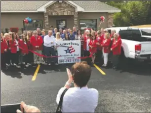  ?? Submitted photo ?? RIBBON CUTTING: Cutting the ribbon on American Termite & Pest Control.