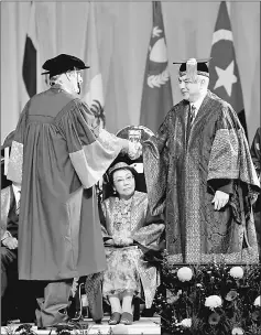  ?? — Bernama photo ?? Nazrin (right) presents the honorary degree to Dr Anthony Crothers Milner at the 57th UM convocatio­n ceremony at Dewan Tunku Canselor.