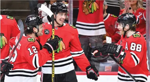  ?? JAMIE SABAU/GETTY IMAGES ?? Dylan Strome (center) meshed well with Alex DeBrincat (left) and Patrick Kane on the top line during the second half of the season.