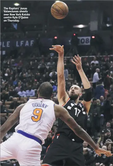  ?? STAN BEHAL ?? The Raptors’ Jonas Valanciuna­s shoots over New York Knicks centre Kyle O’Quinn on Thursday.