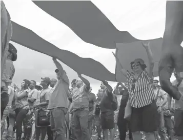  ?? DANICA COTO, AP ?? People protest looming austerity measures in San Juan, Puerto Rico, on Monday.