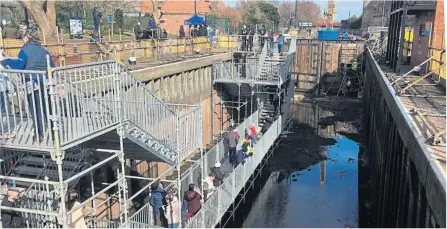  ?? ?? Visitors on the viewing platform at the bottom of the lock.