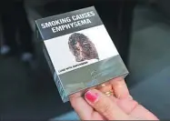  ?? JASON REED / REUTERS ?? Restrictiv­e packaging for cigarettes sold in Australia.