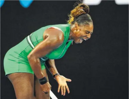  ?? AP PHOTO/KIN CHEUNG ?? Serena Williams reacts during her fourth-round match against Simona Halep at the Australian Open on Monday in Melbourne. Williams defeated the women’s world No. 1 player 6-1, 4-6, 6-4.