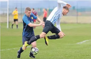  ??  ?? This FC Boukir player is sent flying against Sidlaw Albion. It was Boukir who were flying high after a 5-0 success.