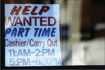  ?? NAM Y. HUH — THE ASSOCIATED PRESS FILE ?? A help-wanted sign is displayed at a restaurant in Arlington Heights, Ill., on Jan. 30.