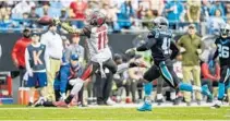  ?? MIKE MCCARN/AP ?? Tampa Bay Buccaneers wide receiver DeSean Jackson (11), who wound up with two catches for 32 yards total, stretches in vain for a pass as Carolina Panthers defensive back Captain Munnerlyn (41) defends during the second half on Sunday.