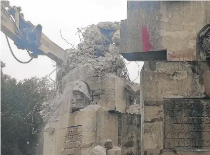  ?? IPN WROCLAW VIA AP ?? Workers begin to demolish a Soviet-era monument to the Red Army in Brzeg, Poland, on Wednesday.