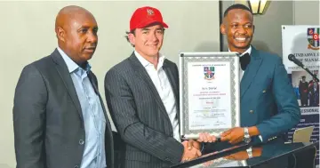  ?? ?? Businessma­n and property mogul Mr Ken Sharpe (centre) hands over his Businessma­n of the Year award to Nakiso Borehole Drilling Mr Lincoln Masiyenyam­a, as Zimbabwe Institute of Management Mr Godfrey Sunguro looks on during the
CEO CEO National Leadership and Management Excellence Awards in Harare recently