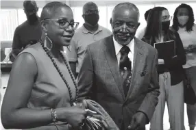  ?? RONDONE/THE COMMERCIAL APPEAL JOE ?? Carl Payne and Rolanda Holman, the father his sister of Pervis Payne, gather outside the courtroom after a hearing for a motion regarding Pervis' intellectu­al disability claim at Shelby County Criminal Court on Friday, July 16, 2021.