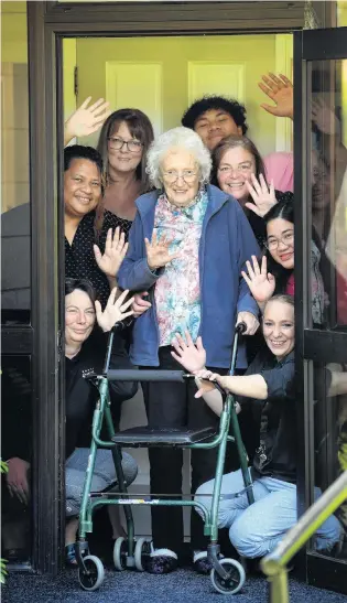  ?? PHOTO: STEPHEN JAQUIERY ?? Next level care . . . Bradford Manor Rest Home staff (from bottom left) Juanita Arthur, Keili Amato, Michelle Donaldson, Lo Amato, Brenda Eriepa, Allean Apolinario, and Phillipa Cameron will be living at the home during the lockdown to help protect residents such as May (centre) from being infected with Covid19.