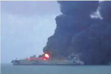  ?? GETTY IMAGES ?? This frame grab taken from Chinese state broadcaste­r CCTV shows smoke and flames coming from a burning oil tanker off the coast of eastern China. The crew of the Iranian tanker have not be found after the ship collided with a freighter carrying grain...