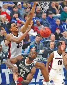  ?? THE ASSOCIATED PRESS ?? Georgia’s Nicolas Claxton dunks over Vanderbilt’s Djery Baptiste during their first-round game at the SEC tournament on Wednesday night.