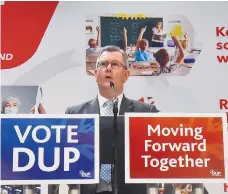  ?? (Clodagh Kilcoyne/Reuters) ?? DEMOCRATIC UNIONIST PARTY leader Jeffrey Donaldson speaks yesterday as he launches the DUP election manifesto at a dieselgene­rating facility in Craigavon, Northern Ireland.