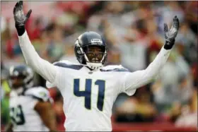  ?? JOHN HEFTI — THE ASSOCIATED PRESS ?? Seattle Seahawks cornerback Byron Maxwell celebrates after an intercepti­on by teammate Bobby Wagner during the first half of an NFL football game against the San Francisco 49ers Sunday in Santa Clara