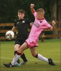  ??  ?? Luke Greene of theWexford F.C. Under-15 team battles with Kane Rowlands (Cobh Ramblers) in their inaugural League of Ireland game on Sunday which marked the opening of ‘Hoxey’ Travers Memorial Park, the home of Gorey Rangers F.C.