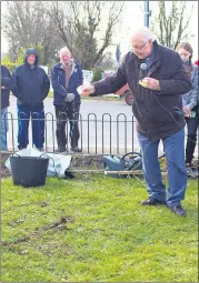  ?? (Pic: Elise Cotter) ?? Fr O’Donnell blessing the ground and tree.