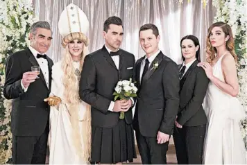  ?? POP TV ?? Eugene Levy as Johnny, from left, Catherine O’Hara as Moira, Dan Levy as David, Noah Reid as Patrick, Emily Hampshire as Stevie, and Annie Murphy as Alexis appear in the series finale of “Schitt’s Creek,” which garnered several Emmy nods.