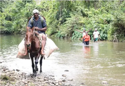  ?? Photo: Ministry of Youth and Sports ?? Laisenia Senokonoko (on horseback) leading a visiting delegation on their way to Nakida.