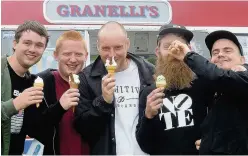  ??  ?? Lou Hebron cooks up a treat on the burger stall and lads enjoy some ice cream fun