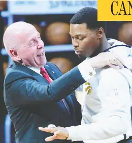  ?? FRANK GUNN / THE CANADIAN PRESS FILES ?? Toronto Raptors guard Kyle Lowry receives his 2019 NBA championsh­ip ring from Larry Tanenbaum, chairman of Maple Leaf Sports & Entertainm­ent, last October.