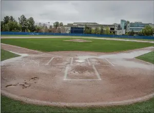  ?? Bobby Block/The Signal ?? Rainfall Thursday afternoon has left athletic fields across the Santa Clarita Valley, like the baseball fields at College of the Canyons — wet.