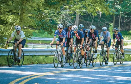  ?? JERRY JACKSON/BALTIMORE SUN ?? Team USA U23 riders overtake a local cyclist while climbing Loch Raven Drive in Baltimore County in preparatio­n for Sunday’s Maryland Cycling Classic. The portion of the 120.4-mile course in Baltimore County could be the turning point Sunday, and a projected forecast of hot and humid weather could also play a role in determinin­g the winner.