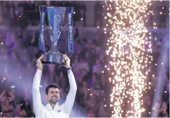  ?? REUTERS ?? Novak Djokovic lifts the ATP Finals trophy after defeating Casper Ruud.