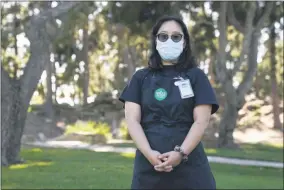  ?? THE ASSOCIATED PRESS ?? Katie Doan, a former Whole Foods employee, poses for a photo Thursday, July 16, 2020, in Costa Mesa, Calif. Doan started tracking COVID-19 cases at Amazon-owned Whole Foods in April.