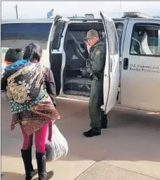  ??  ?? BORDER PATROL agents in Presidio, Texas, prepare to drive new arrivals to another Big Bend-area station for processing.