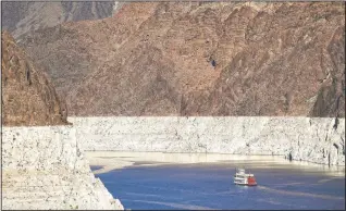  ?? (File Photo/AP/Jae C. Hong) ?? A riverboat glides through Lake Mead in 2015 on the Colorado River at Hoover Dam near Boulder City, Nev.