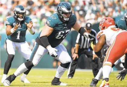  ?? TERRANCE WILLIAMS/AP ?? Eagles offensive guard Nate Herbig (67) prepares to block for quarterbac­k Jalen Hurts at the start of a third-quarter play Sunday against the visiting Kansas City Chiefs.