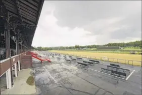  ?? Lori Van Buren / times union ?? Storm clouds move in above Saratoga race Course on tuesday. no one outside of those deemed to be essential workers will be allowed at the track when the 152nd meet starts on thursday.