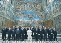  ?? (Osservator­e Romano/Reuters) ?? POPE FRANCIS poses in the Sistine Chapel during a meeting with EU leaders at the Vatican last week.