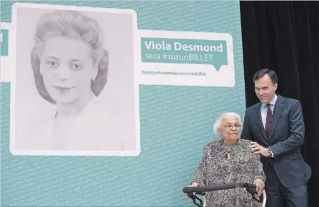  ?? ADRIAN WYLD CANADIAN PRESS FILE PHOTO ?? A $10 bill will feature civil rights pioneer Viola Desmond. In this 2016 photo, Finance Minister Bill Morneau poses with Wanda Robson, her sister.