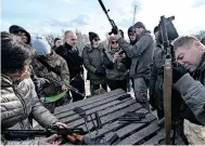  ?? ?? RESIDENTS attend training for civilians by war veterans and volunteers who teach the basic weapons handling in Kyiv. There is growing concern over the proliferat­ion of weapons in Ukraine. | AFP