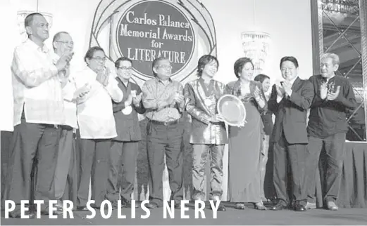  ??  ?? Nery accepts his Hall of Fame plaque from Sylvia PalancaQui­rino ( third from right), director general of the Carlos Palanca Foundation, and Carlos Palanca 4th ( second from right) as ( from extreme left) previous Hall of Fame inductees Manuel Buising,...